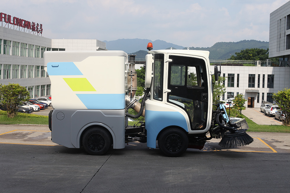 Performance and structural characteristics of FULONGMA intelligent electric road sweeper FULONGMA Intelligent Electric Road Sweeper is an automatic cleaning integrated machine that combines road dust collection, sweeping, water spraying, and garbage transportation. It is a new type of cleaning equipment used in outdoor environments. The intelligent electric road sweeper is suitable for outdoor cleaning in parks, sanitation, cleaning companies, property management companies, squares, universities, highways, squares, etc. 01. Picture of Smart Electric Road Sweeper 02. Performance characteristics of intelligent electric road sweeper 1. Electric operation, no noise, no exhaust gas emissions, clean and environmentally friendly. 2. Small size, flexible turning, easy to drive, convenient maintenance, suitable for most manual cleaning places. 3. Integrate sweeping and suction, no secondary pollution, no secondary dust. 4. The cleaning effect is good, as small as dust and sand, as large as stones, broken bricks, leaves, and cigarette cases, it can be cleaned in one go. 5. Mechanized operation is not only efficient and effective, and the machine is clean wherever it goes, but also avoids the phenomenon of flying dust, difficult dust, and missed sweeping in manual cleaning. 03. Structural characteristics of intelligent electric road sweeper 1. Concise and clear operation interface, suitable for people of all ages to operate. 2. Adopt high-performance maintenance-free battery, no leakage, no harmful gas. 3. Humanized design, equipped with fan. The powerful fan has strong suction power and good sweeping effect. Through the reasonable design of the hydraulic system, the effect of automatically dumping the garbage in the trash can is achieved, thereby greatly reducing the labor intensity of the operator. 4. With cleaning and throwing technology, the theoretical value of the dust box utilization rate is high. 5. Well-known brand parts provide a good foundation for the stable performance of the product. 6. Solid tires, sturdy and durable. 7. Intelligent electronic control system, over-current, under-voltage protection, aggravated chassis, large garbage bin volume. 03. Video of Smart Electric Road Sweeper